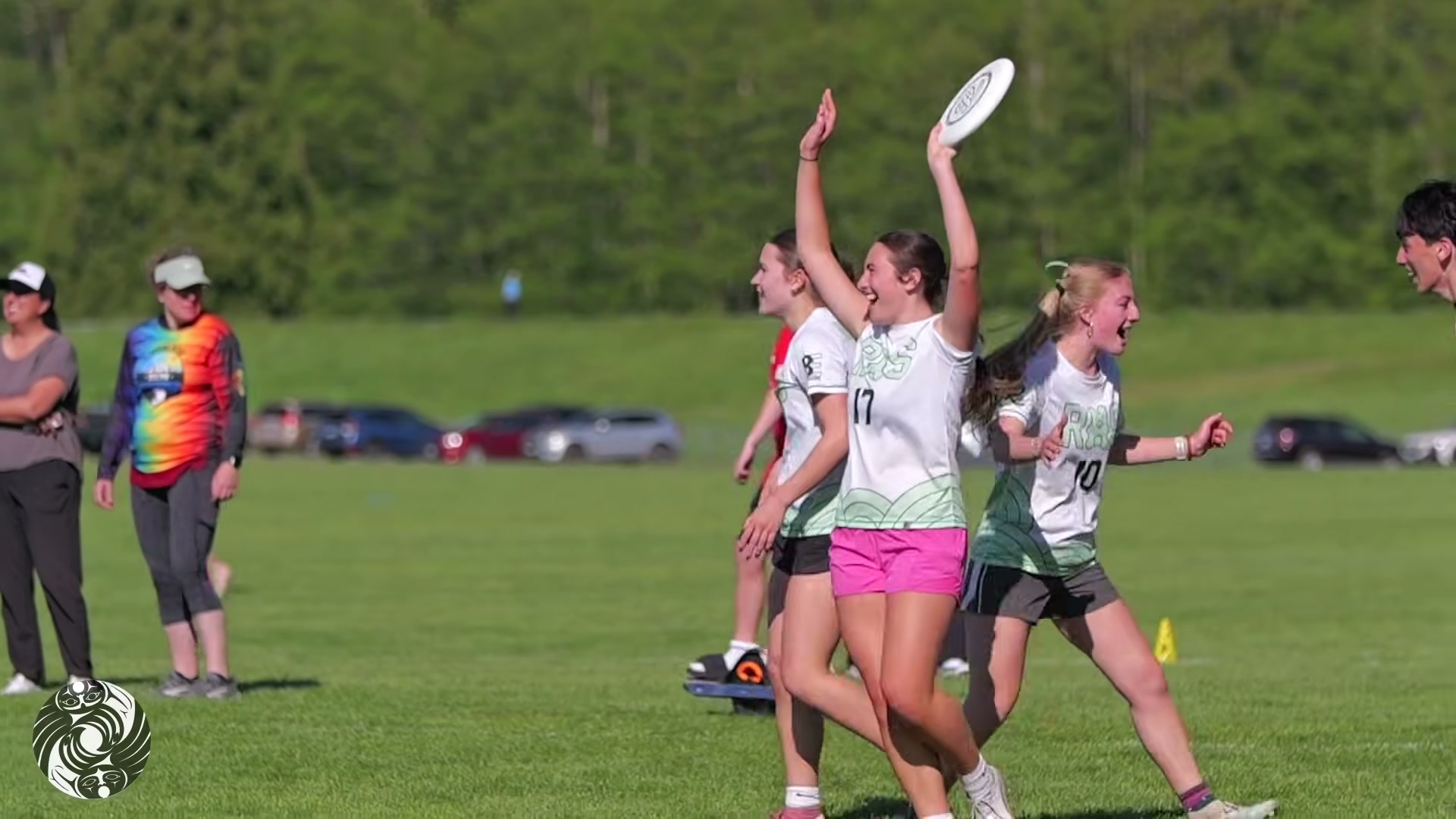 Young players celebrating a catch during a game