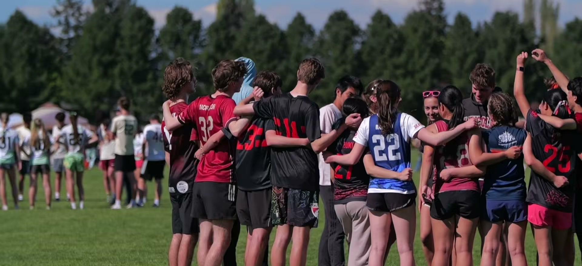 Players from both teams gathered in a spirit circle after a game